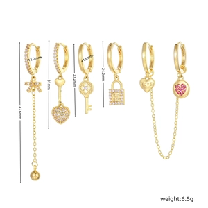 Detailed set of six gold-plated heart earrings with zircons and letter H charms