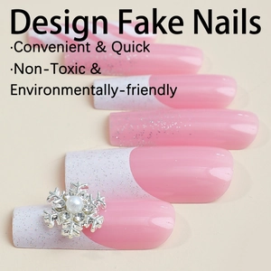 Pink and white French press-on nails with snowflakes and pearls in long square shape
