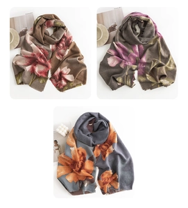 Three elegant cashmere-style scarves with floral paisley prints and stylish tassels