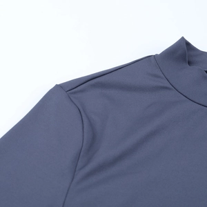 Detailed view of dark grey-blue half-high collar and seamless shoulder stitching