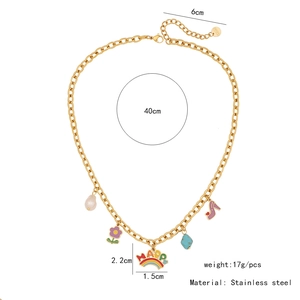 Detailed view of stainless steel necklace with rainbow, flower and pearl charms