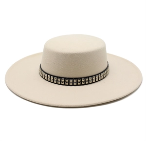 Detail of off-white wool fedora hat featuring black band with metallic square studs