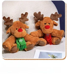 Close-up of plush Christmas reindeer toys with red noses and embroidered snowflake scarves