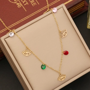 Double-layered golden stainless steel necklace with eye charms and colorful crystals