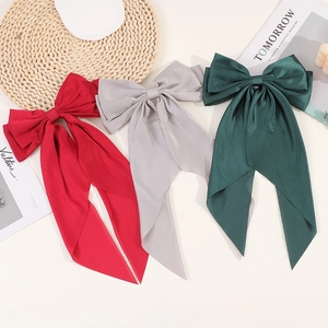 Vintage large satin bow hair clips in red, grey, and green for elegant styling