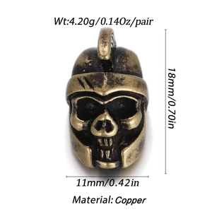 Detail view of 18K gold plated skull charm with helmet showing 18mm height and 11mm width