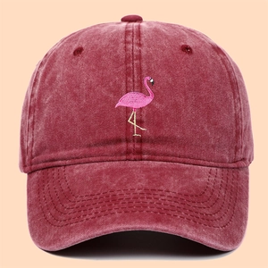 Vintage washed cotton baseball cap featuring a pink flamingo embroidery in maroon red