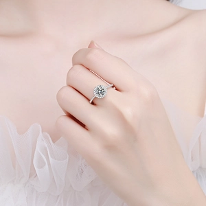 Elegant S925 sterling silver halo ring featuring a round moissanite with pavé accents