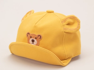 Close-up of yellow baby cotton baseball cap featuring bear ears and cute bear embroidery