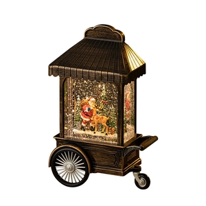 Vintage bronze Christmas cart snow globe featuring Santa Claus and reindeer with LED lights