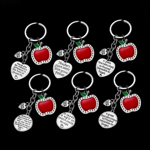 Teacher appreciation keychains with red apple charms and engraved thank you messages