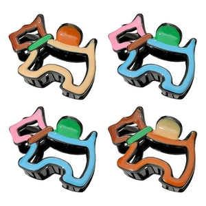 Colorful Scottish Terrier hair claws in various vibrant patterns and glossy finishes