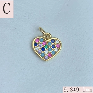 Detail view of 9.3x9.1mm heart pendant with colorful cubic zirconia and gold plating