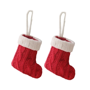 Mini red and white knitted Christmas stockings for cutlery decoration and holiday decor