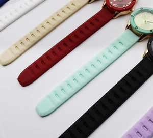 Detailed diagonal view of colorful vintage leather quartz watch straps and golden cases