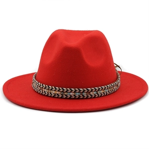 Detail of the colorful woven ethnic band on a red wide brim wool fedora hat