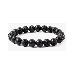 Macro shot of 8mm natural black lava stone beads with porous texture on elastic bracelet