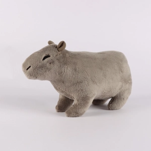 Close-up of the soft gray plush fabric and detailed stitching on the capybara toy