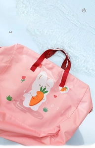 Waterproof detail of pink oxford fabric bag featuring cute rabbit and washable texture