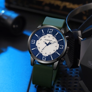Tactical quartz watch with army green silicone strap and large blue numbers on a dark metal case