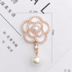 Elegant white camellia flower pendant with gold alloy base and pearl drop accents
