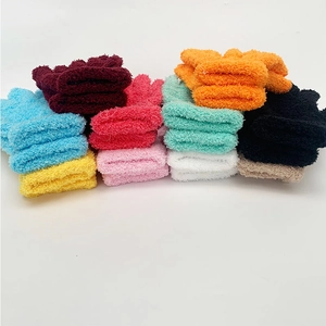 Macro shot of fluffy coral fleece fabric texture in various colorful winter glove options