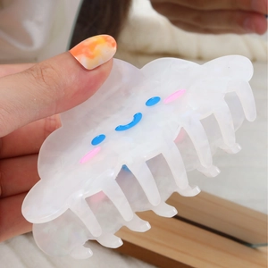 Cute cloud-shaped hair claw clip in white with blue and pink facial expressions