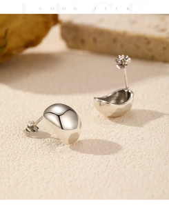Detail of s925 sterling silver stud earrings with organic liquid metal mirror finish