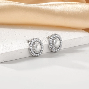 Elegant silver stainless steel oval earrings with pearls on silk background