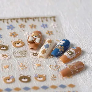Detailed view of 3D embossed bear nail stickers with matte texture and cute bow patterns