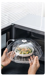 Macro view of heat-resistant microwave cover with thick anti-scald handle over a food bowl