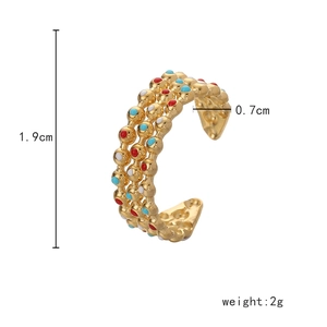 Detail view of adjustable gold ring with red, blue, and white enamel beads, size 1.9x0.7cm