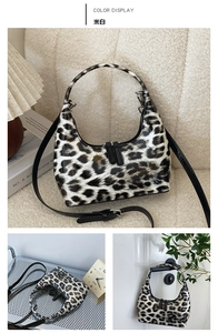 Detail of leopard print faux leather bag with handle and detachable strap in cream white