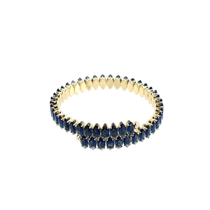 Close-up of gold double-row cuff bracelet with deep blue marquise-cut crystals