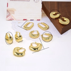 Macro detail of various 18k gold plated hollow earrings with weight and size info