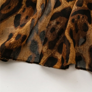 Close-up of leopard print fabric texture on a lightweight cotton linen scarf