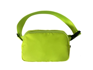 Close-up of lightweight neon green nylon waist bag with resin zipper and black plastic buckle
