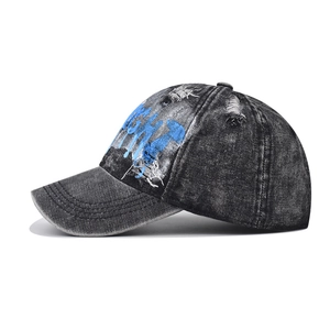 Vintage washed denim baseball cap with blue graffiti print and distressed details