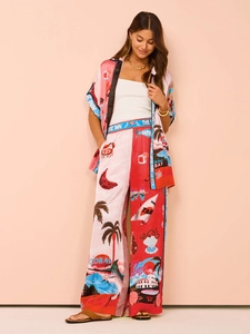 Detail of summer vacation set with pink and red floral prints on light silk fabric