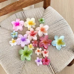 Plumeria flower hair claws in gradient candy colors and multiple sizes for styling