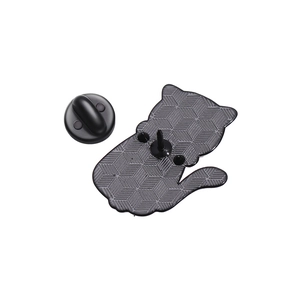 Close-up of black playful cat metal brooch back view with textured surface and rubber clutch