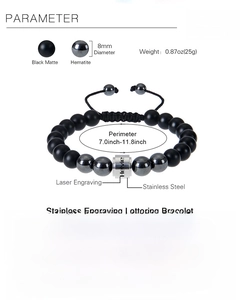 Macro detail of custom engraved stainless steel bead with matte black stones on bracelet