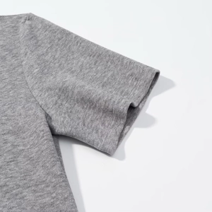 Detailed view of the gray knitted cotton sleeve cuffs and precise stitching on the top
