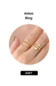 Detail view of double-layered gold ring featuring square and circular geometric motifs
