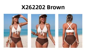 Three-way view of white halter bikini top with brown trim and high-waisted bottoms on beach