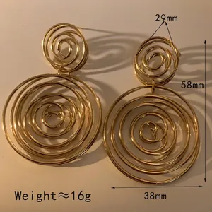 Golden spiral hoop earrings with double concentric circle design in minimalist metal