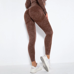 Detail view of coffee seamless scrunch butt leggings with cutout knit and acid wash texture