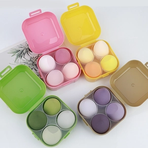 Detailed view of soft makeup sponge sets in colorful storage boxes for dry and wet use
