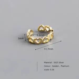 Minimalist S925 silver heart cuff earring in gold finish with hollow heart pattern