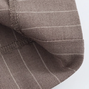 Brown striped straight trousers with detailed fabric texture and premium stitching